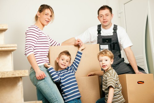 Family packing household items for a Barking removal service
