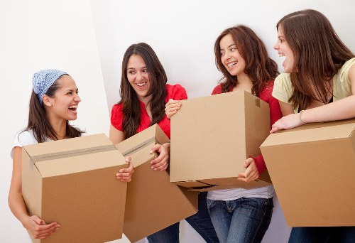 Professional movers transporting office equipment in Barking