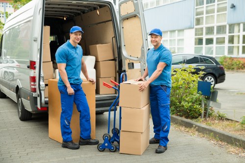 Local moving team loading furniture for a Barking home removal