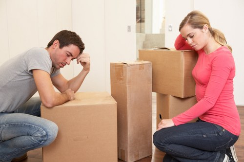 Packed moving boxes and furniture ready for transport in Barking