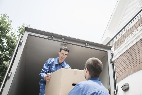 Boxes and furniture being loaded into a removal van