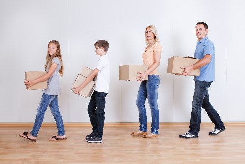 Family home moving preparation with labelled boxes in Barking